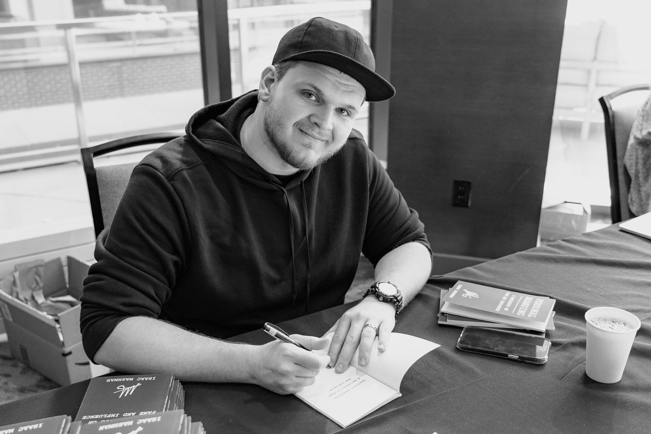 Isaac Mashman signing books in Denver